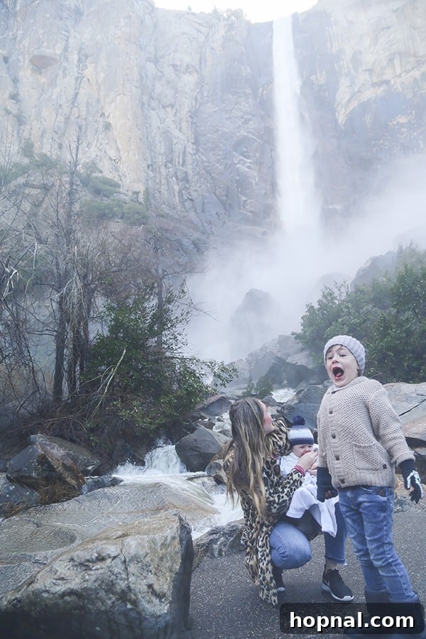 Little Explorers, Big Yosemite 13 Kids delighting in the refreshing mist near a Yosemite waterfall
