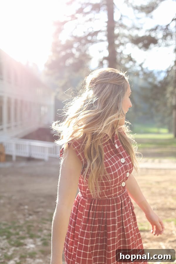 Little Explorers, Big Yosemite 7 Eden Passante in a vibrant red dress, set against the backdrop of Yosemite's natural beauty