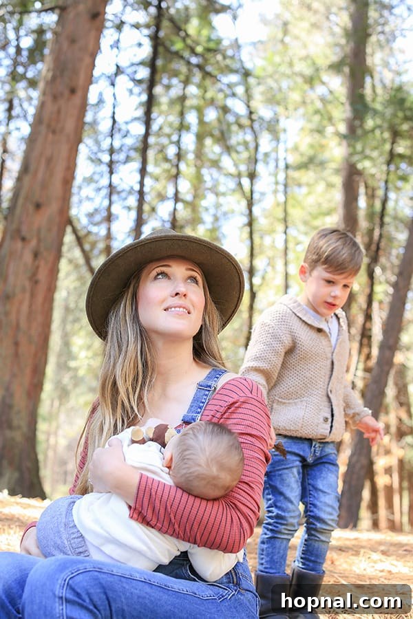 Little Explorers, Big Yosemite 10 Eden Passante holding her baby, enjoying a tender moment amidst Yosemite's beauty