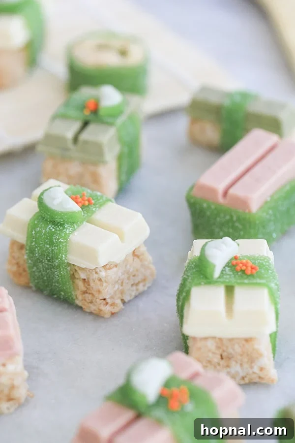 Sweet Sushi Delights with Kit Kat 3 Close-up of various Kit Kat candy sushi pieces, artfully arranged with small fruit garnishes, showcasing the vibrant colors and detailed 'toppings'.