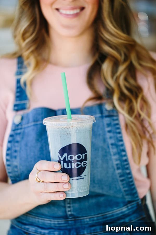 Eden Passante holding Moon Juice smoothie 