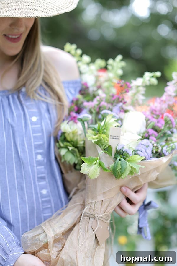 A vibrant, overflowing bundle of fresh, colorful flowers, perfect for a Mother's Day gift or decorative centerpiece.