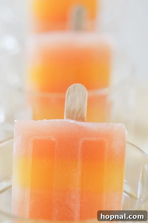 Boozy Greyhound Pops 7 Greyhound cocktail popsicle in a glass, ready to be enjoyed.
