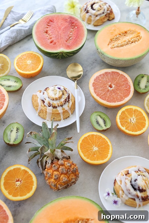 Effortless Brunch Bliss 8 An overhead view of beautifully sliced fruit arranged on a table, highlighting the vibrant colors and effortless presentation.