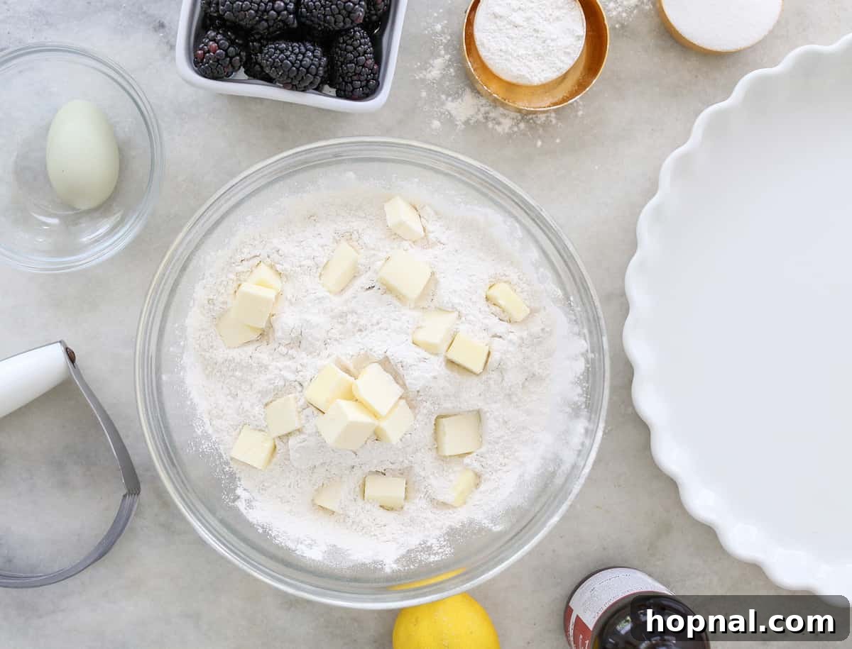 Sweet Blackberry Crumble Cobbler 3 Bowl with flour, cold butter, blackberries and eggs.