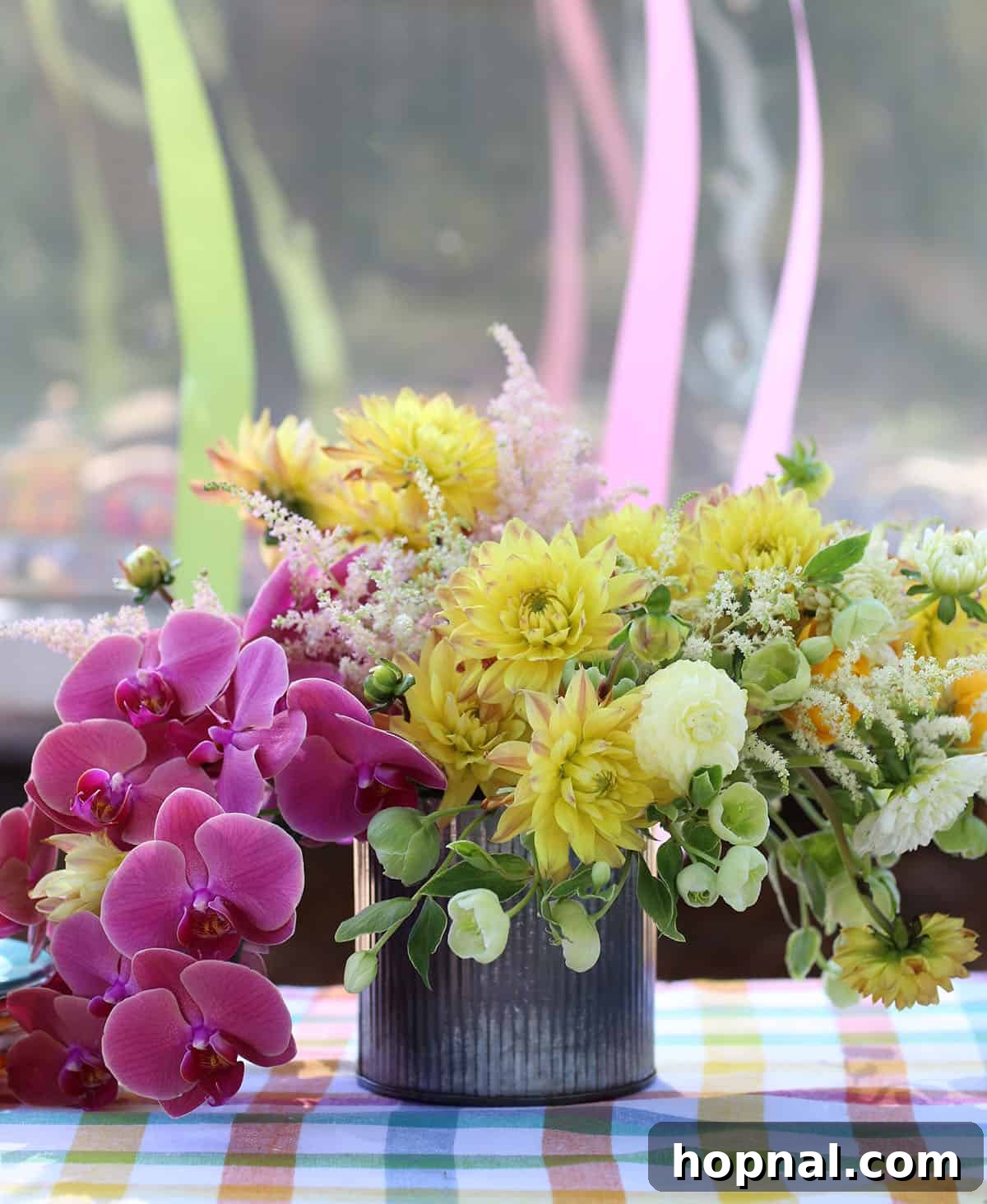 Backyard Big Top Bash 3 Vibrant floral arrangements and colorful details at a carnival theme party