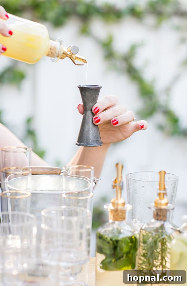 A mixologist pouring fresh citrus juice into a cocktail jigger, emphasizing precise measurement for delicious cocktails.