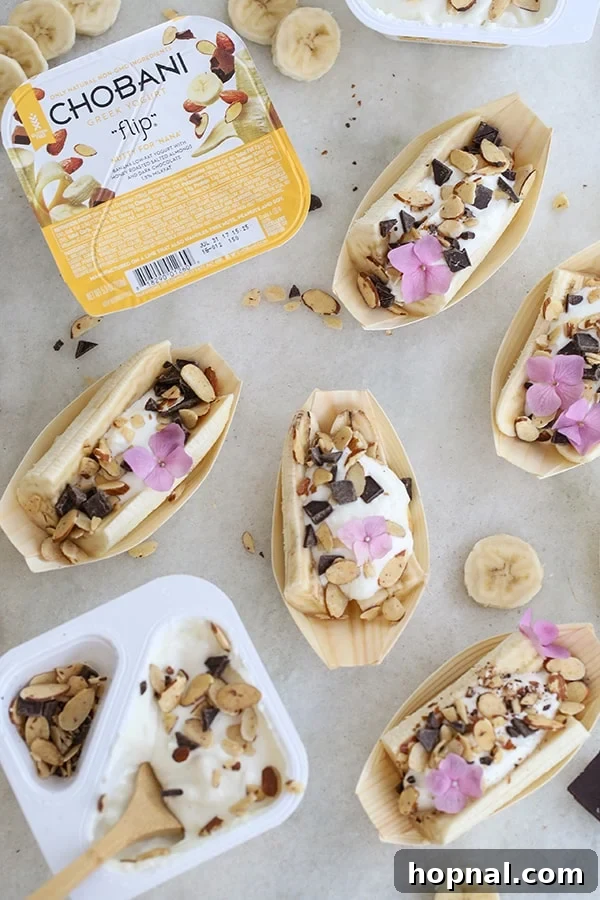 Banana Split Fever 6 Nana Splits presented with various toppings and delicate edible flowers, highlighting their aesthetic appeal and suitability for special occasions.