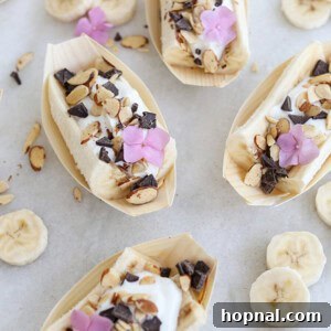 Banana Split Fever 7 Mini banana splits with Chobani Flip yogurt, elegantly arranged for a delicious and healthy treat, showcasing vibrant colors and fresh toppings.
