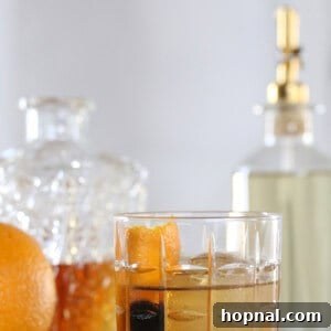 How to make a classic old fashioned cocktail with Angostura bitters, orange slice, and bourbon or rye whiskey
