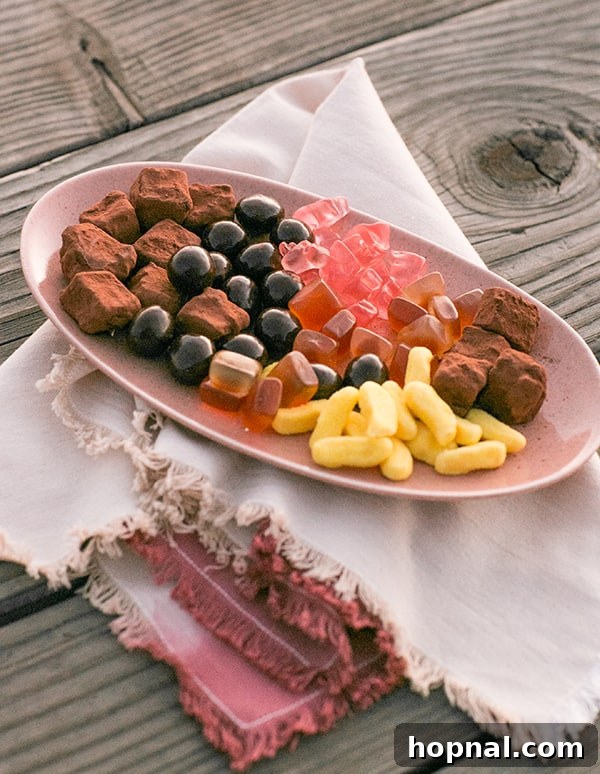 The Art of Airstream Entertaining in Malibu 17 An enticing dessert platter laden with a variety of candies and treats, beautifully arranged for a glamping sweet ending.