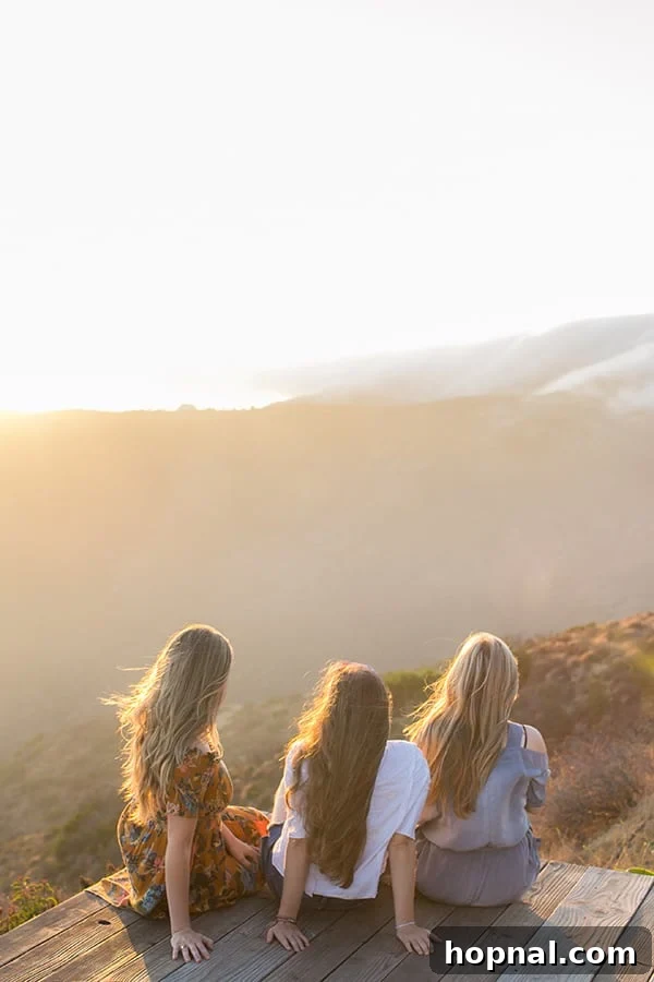 The Art of Airstream Entertaining in Malibu 18 Girls gazing out at the magnificent Malibu sunset, captivated by the natural beauty and the unique glamping experience.