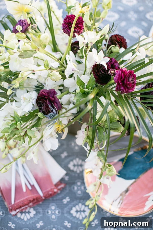 The Art of Airstream Entertaining in Malibu 6 A beautiful, vibrant floral arrangement adding elegance to the glamping table setting in Malibu.