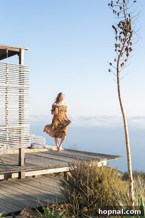 The Art of Airstream Entertaining in Malibu 10 Eden Passante enjoying the stunning views and fresh air in Malibu, embodying the serene glamping lifestyle.