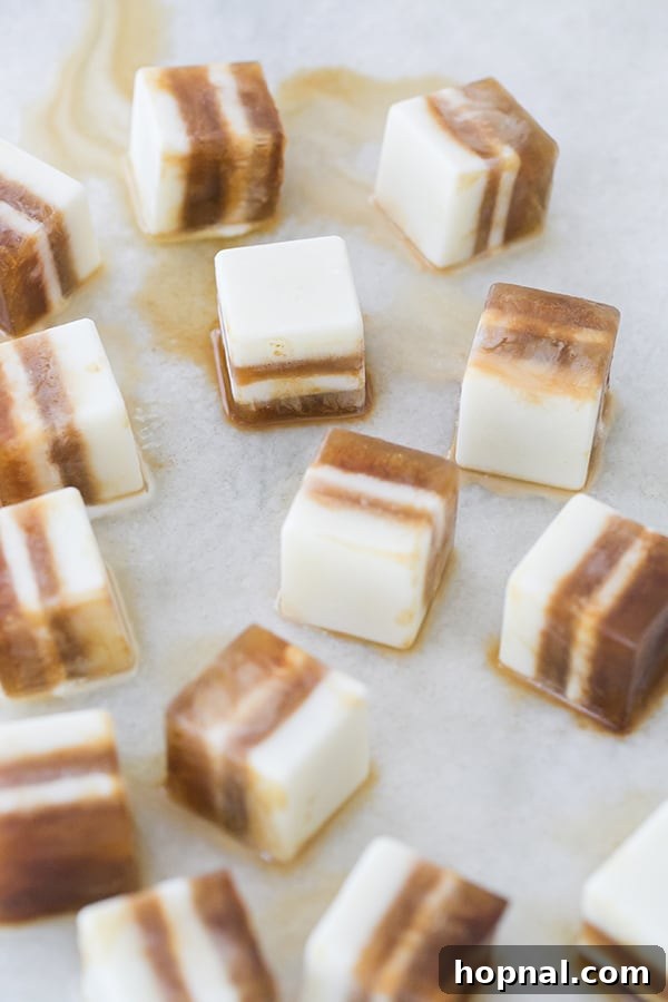 Pumpkin Spice Coffee Chillers 5 Several simple pumpkin spice and hazelnut coffee cubes in a silicone ice tray, partially frozen.