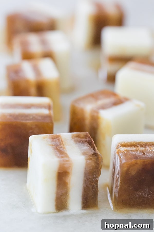 Pumpkin Spice Coffee Chillers 6 Recipe for layered coffee ice cubes for iced coffee showing distinct coffee and creamer layers in a silicone tray.