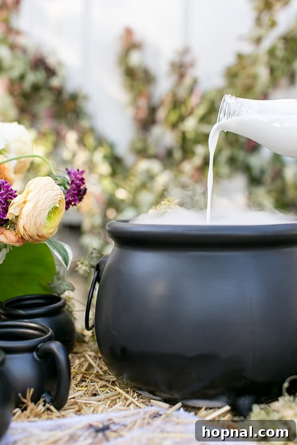 side shot of a big cauldron with cream being poured in - coffee recipe, pumpkin spice