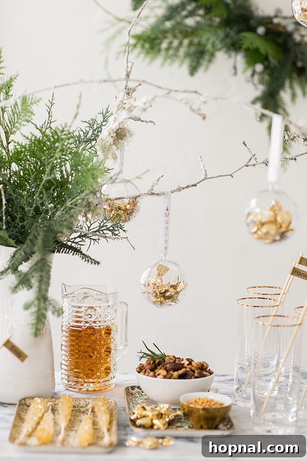 Side shot of a beautifully decorated holiday drink station with cocktails and festive snacks, evoking a warm Winter Wonderland theme