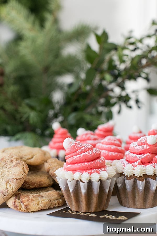 An inviting party table featuring an array of cookies and cupcakes, ready for guests to enjoy.