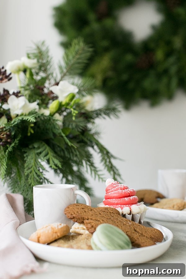 A close-up shot of a decorative plate heaped with a colorful assortment of freshly baked cookies, ready for sharing.