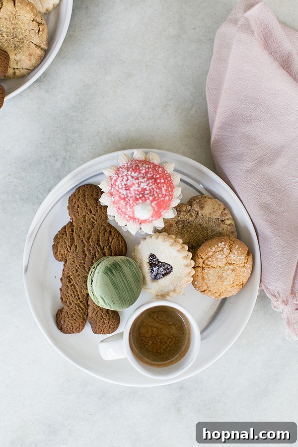 A charming table display featuring a gingerbread man cookie, other sweet treats, and festive decorations, suggesting a cozy holiday gathering.