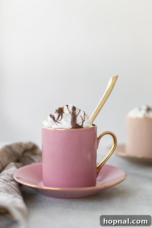 Hazelnut Cocoa Indulgence 6 A cozy, inviting pink mug filled with steaming hazelnut coffee, hinting at warmth and comfort on a crisp morning.