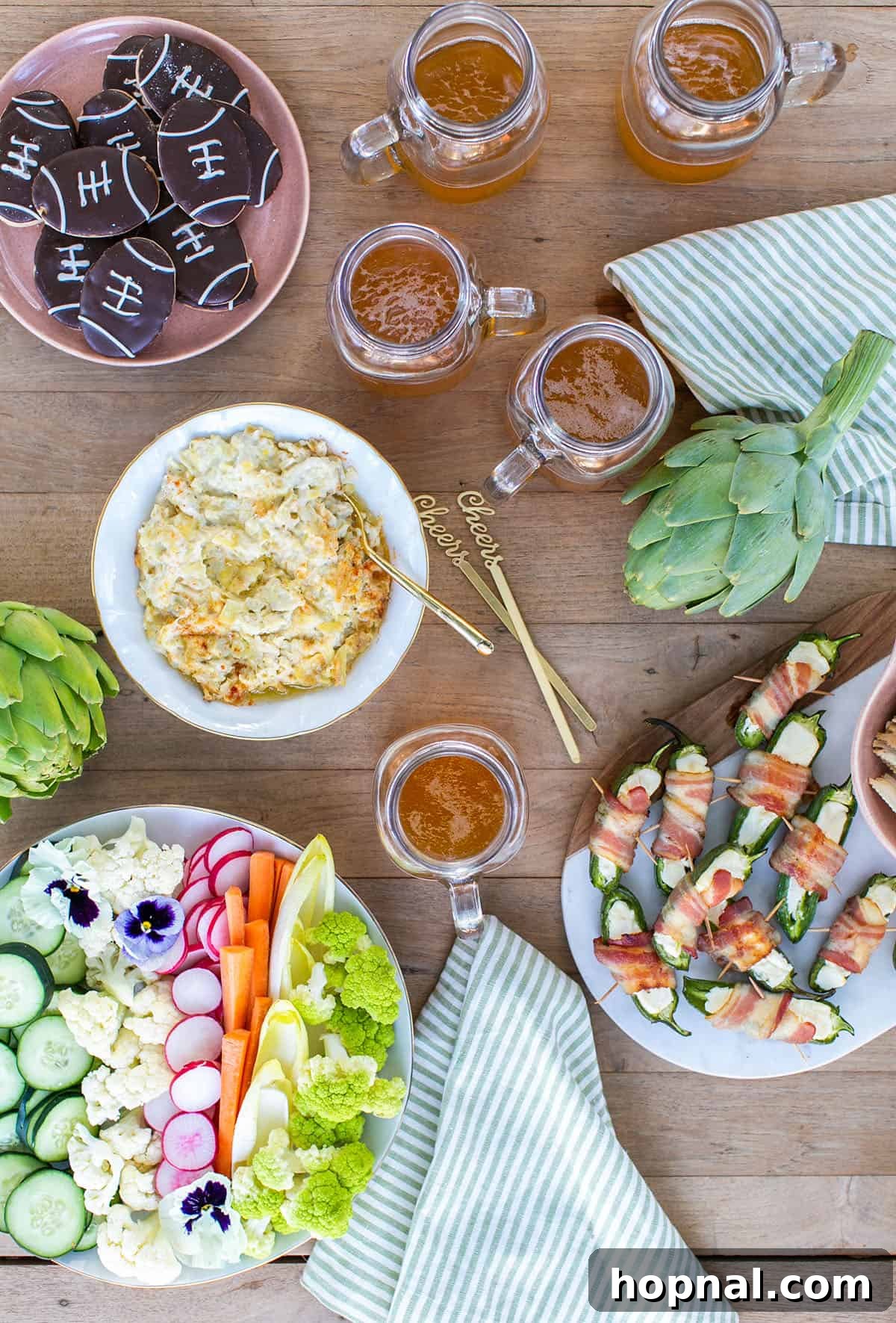 A festive table laden with a variety of delicious game day food, including dips, chips, and snacks, ready for a party.