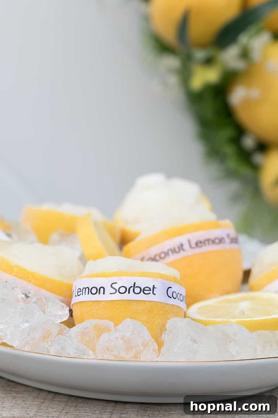 A single portion of lemon sorbet, beautifully scooped into a lemon shell, ready to be enjoyed as a refreshing and elegant dessert.