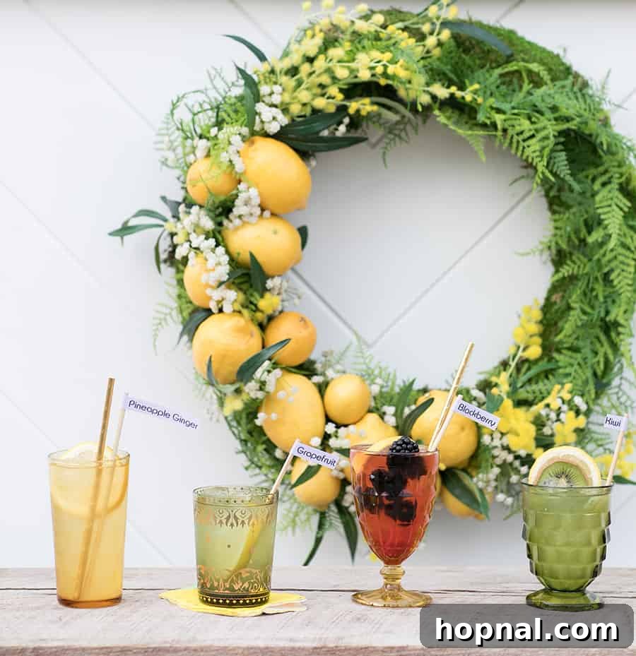 Several vintage glasses filled with golden spiked lemonade, garnished with fresh lemon slices and berries, ready for enjoyment.