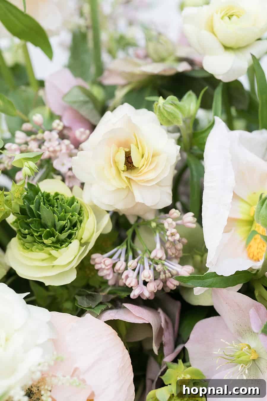 Close-up photograph of elegant white and yellow flowers, providing a delicate, fresh, and sophisticated decorative element.