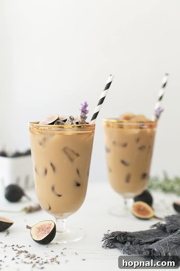 Side angle shot of a perfectly prepared Fig and Lavender Cold Brew, showcasing its inviting layers and rich color.