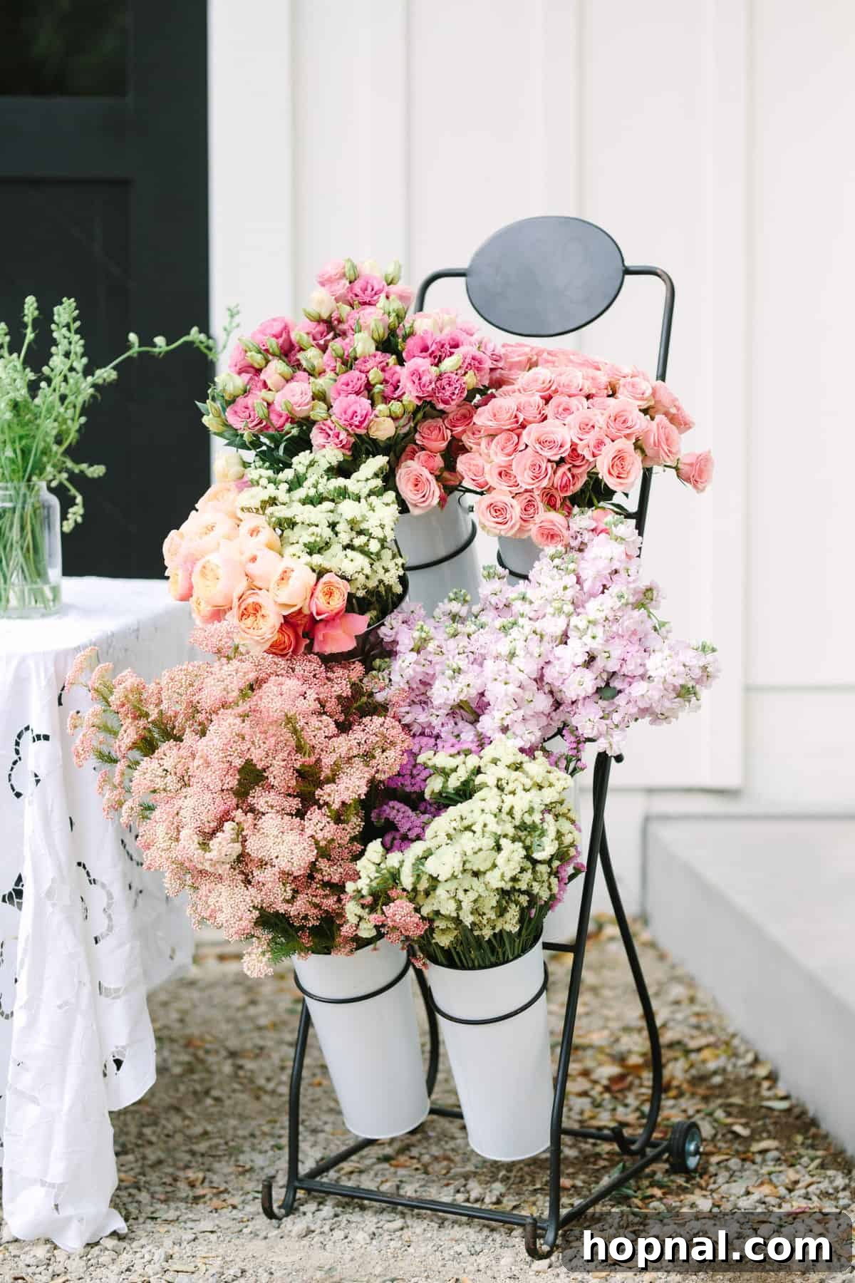 Planting Seeds for Success: A ScholarShare 529 Spring Brunch 12 Guests at a flower station, arranging flowers