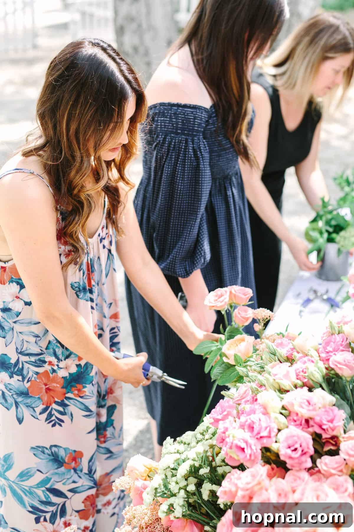 Planting Seeds for Success: A ScholarShare 529 Spring Brunch 16 A guest carefully selecting flowers for her arrangement