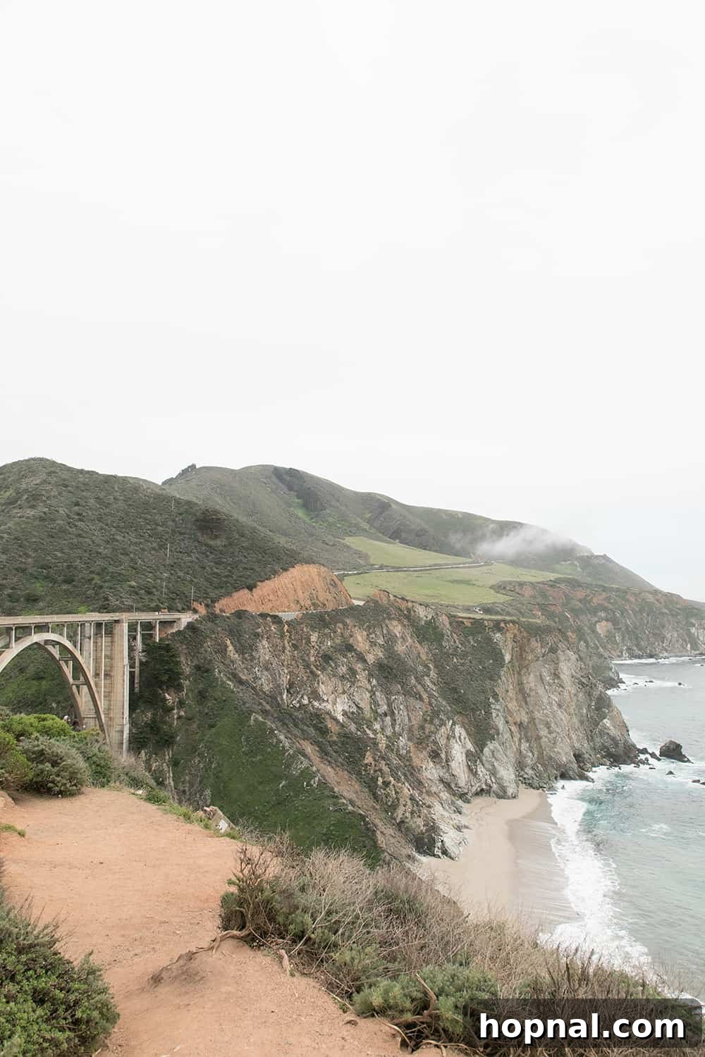 Big Sur One Day: Your Scenic Coastal Itinerary 13 Bixby Bridge spanning a canyon with lush green mountains in Big Sur