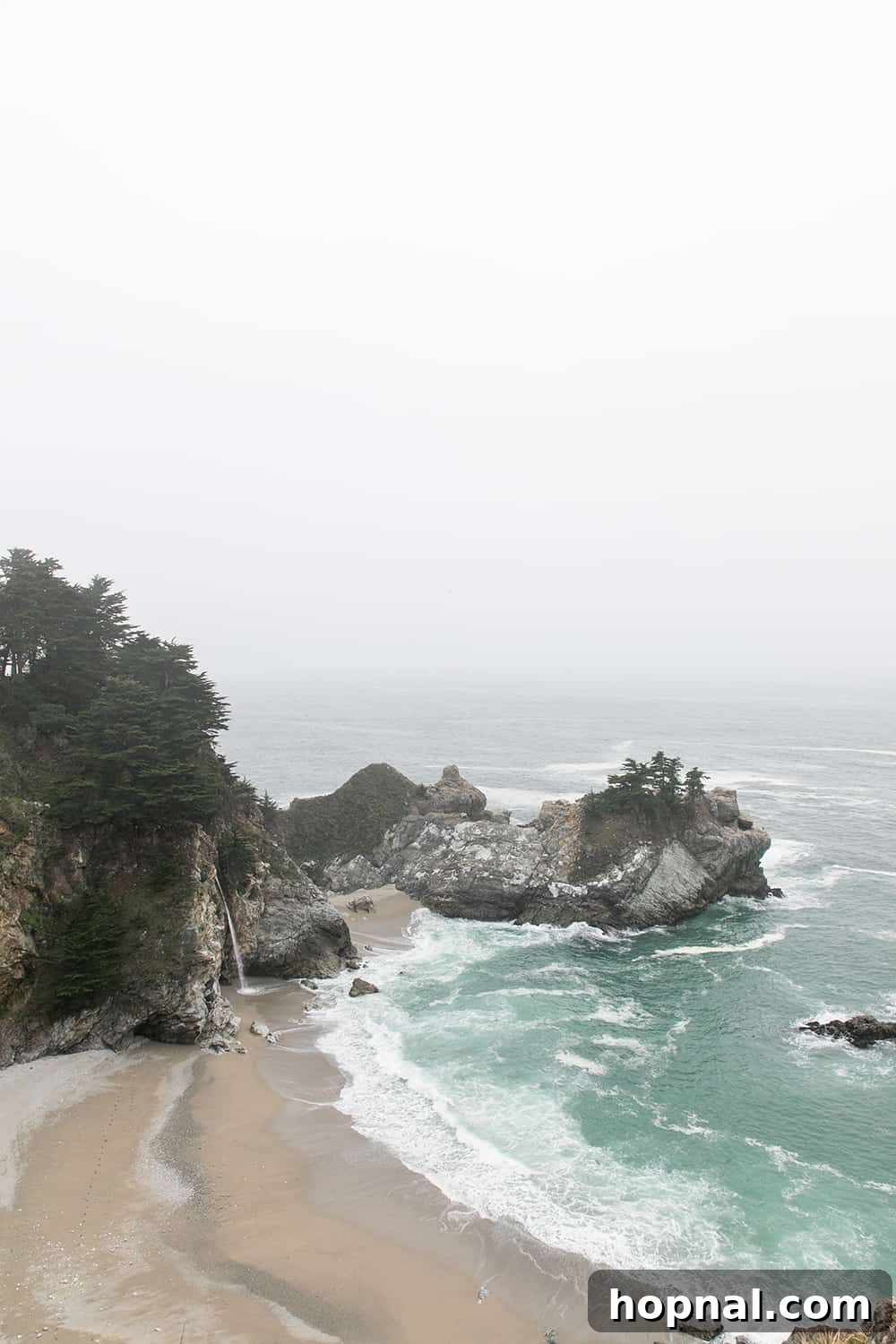 Big Sur One Day: Your Scenic Coastal Itinerary 6 McWay Falls cascading onto sandy beach at Julia Pfeiffer Burns State Park