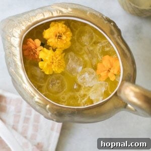 top down shot of tropical punch in a bowl with fresh fruit