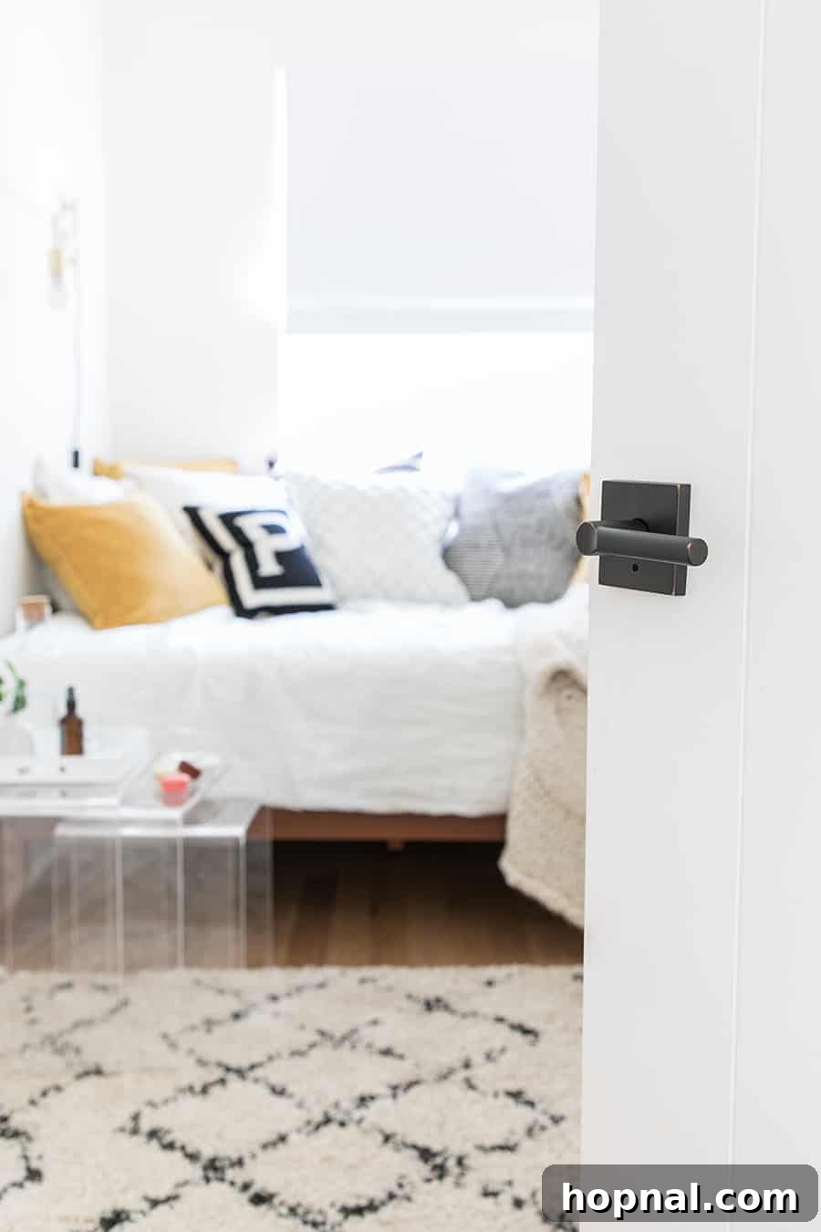 Designing a Welcoming Guest Room Oasis 14 Door open to a guest bedroom