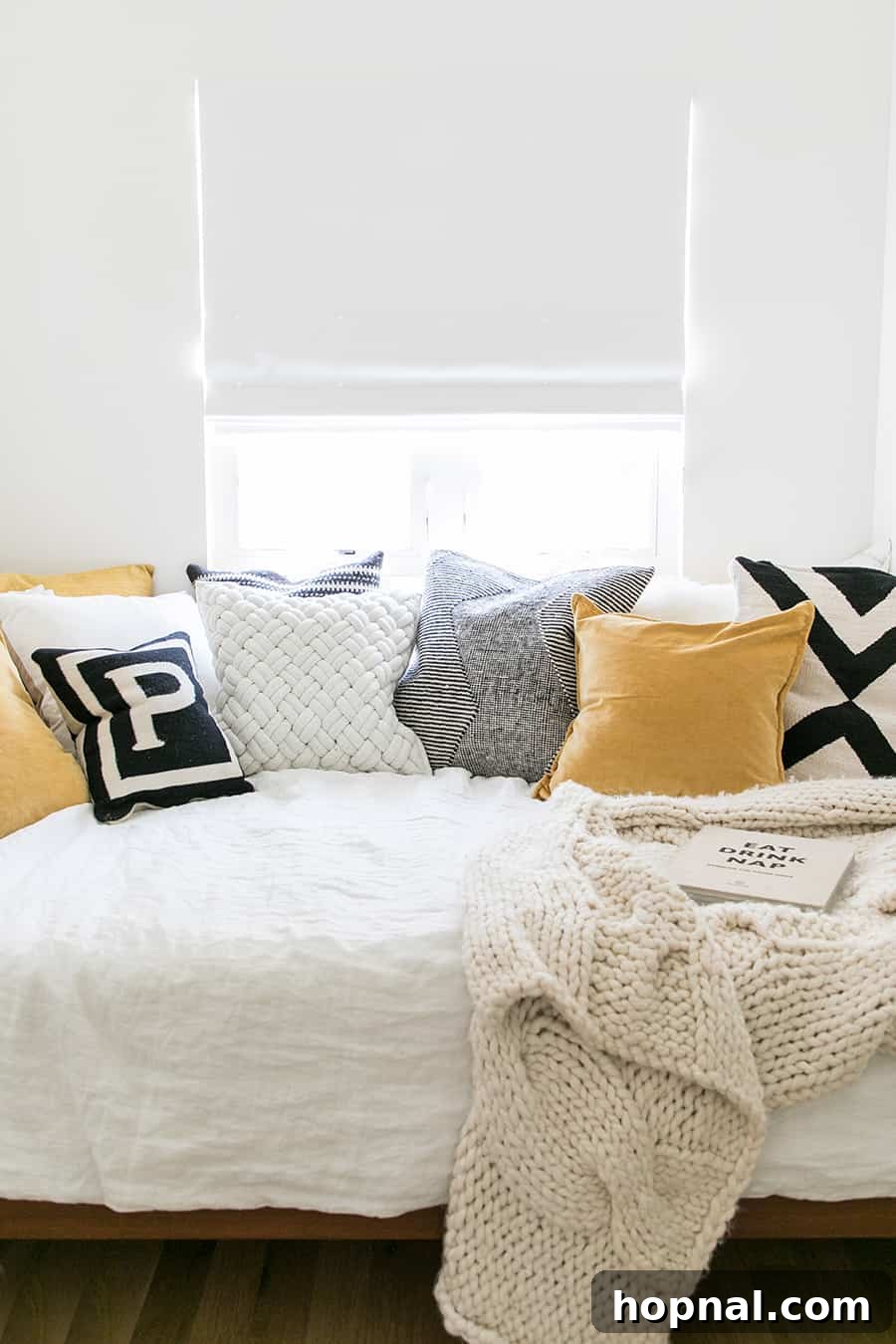 Designing a Welcoming Guest Room Oasis 3 guest bedroom ideas to add throw pillows yellow and black on a guest bedroom.