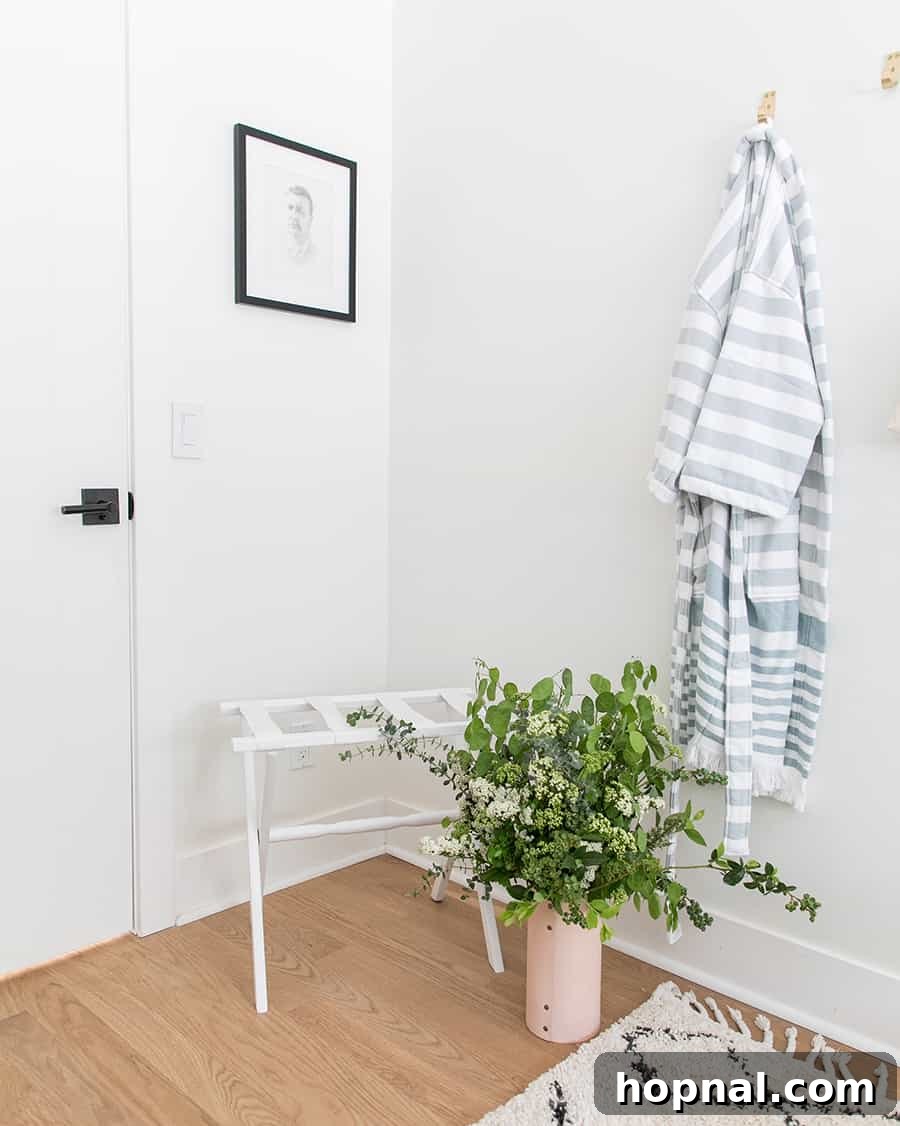 Designing a Welcoming Guest Room Oasis 7 Cozy robe, luggage rack and brass hooks