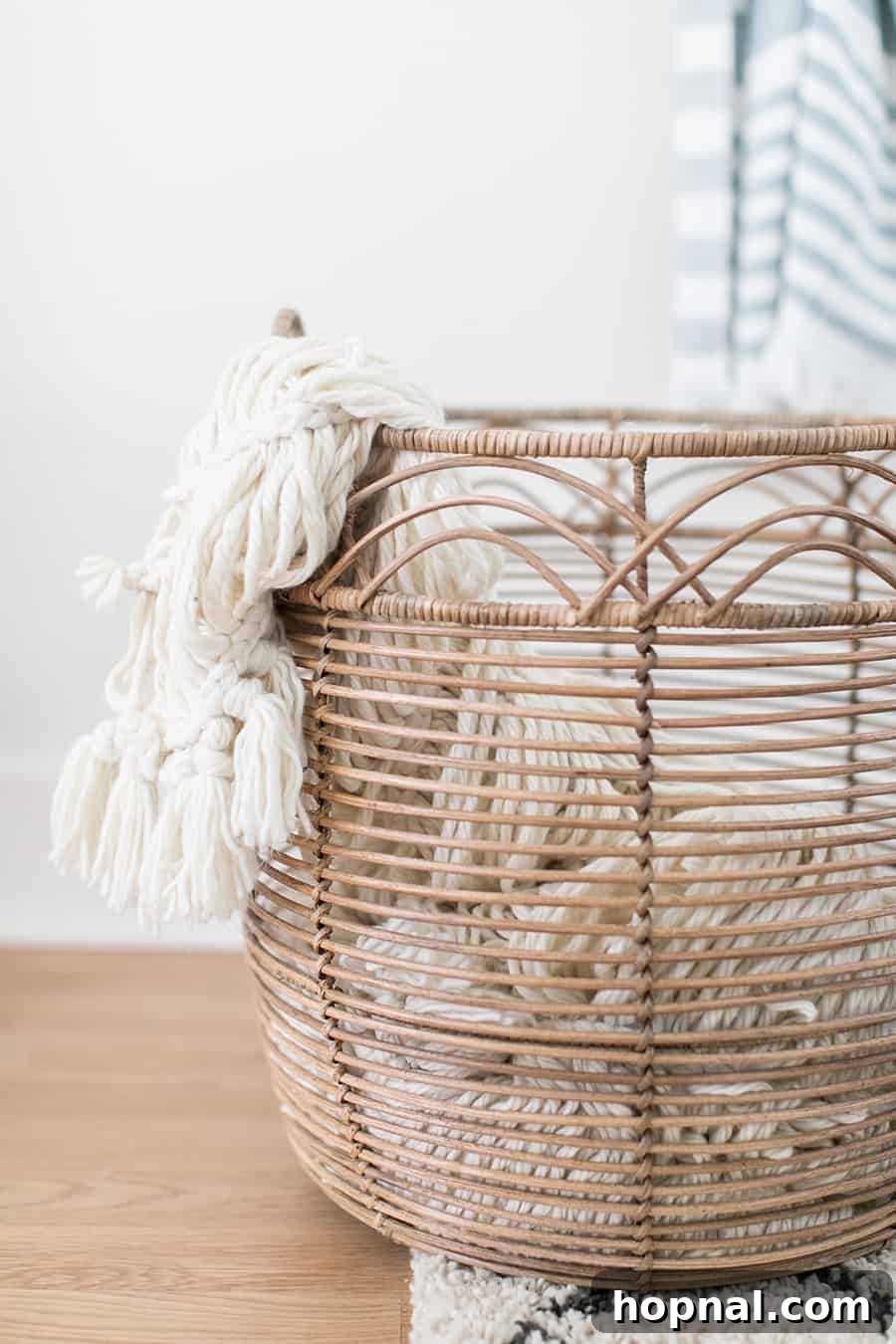 Designing a Welcoming Guest Room Oasis 9 Laundry basket with a knit blanket