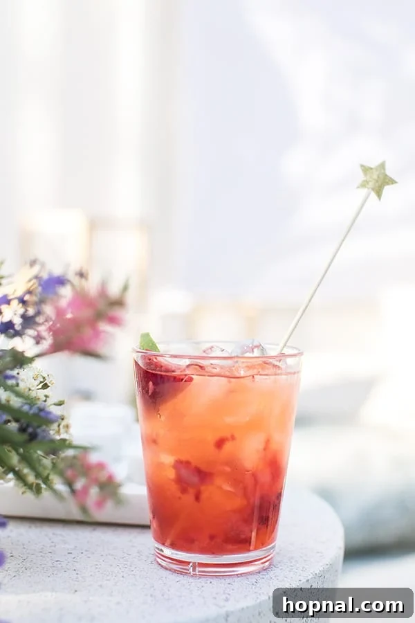 A finished strawberry tequila soda cocktail in a glass, ready to be enjoyed.