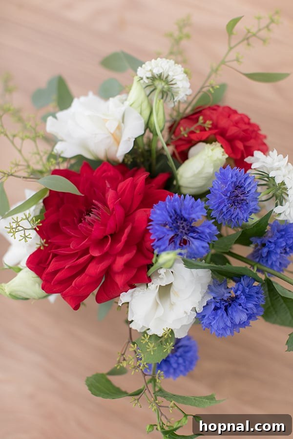Beautiful close-up of a red, white, and blue flower arrangement, showcasing vibrant blooms.