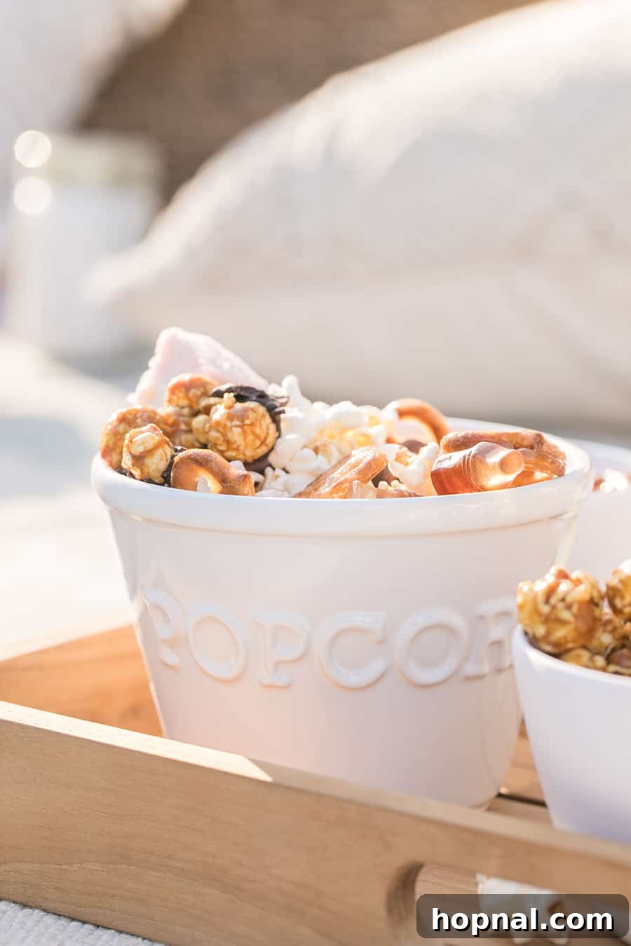 Lights, Camera, Backyard: Your Outdoor Movie Night Guide 12 A bowl of popcorn mixed with chocolate and pretzels.