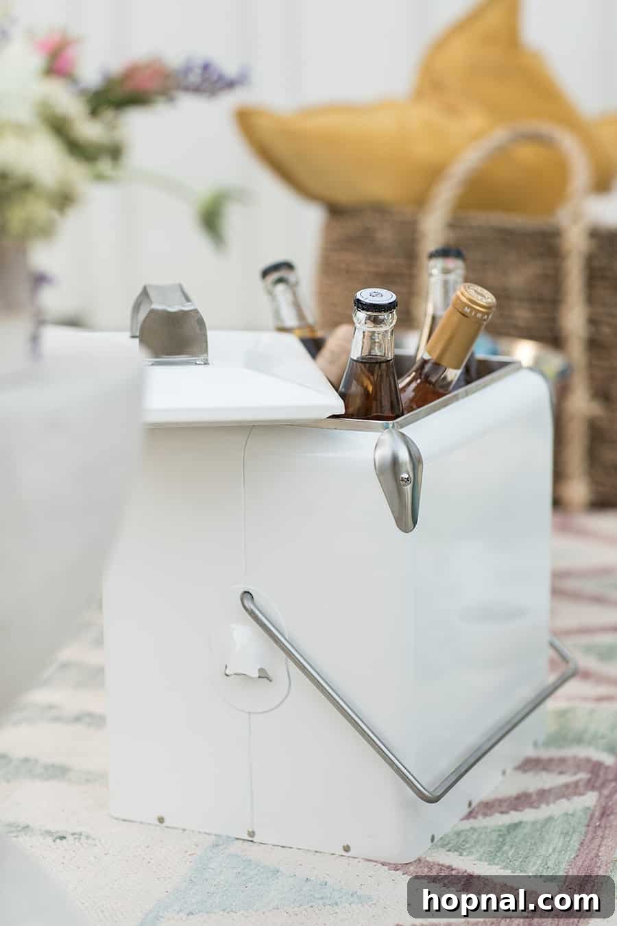 Lights, Camera, Backyard: Your Outdoor Movie Night Guide 16 A pristine white cooler filled with various bottles of wine, suggesting a well-prepared outdoor event.