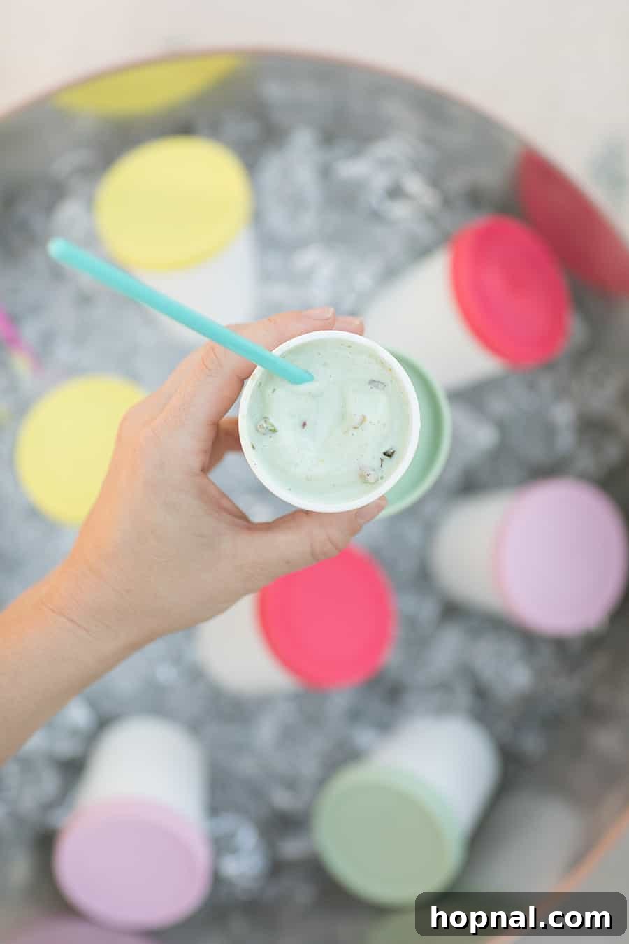 Lights, Camera, Backyard: Your Outdoor Movie Night Guide 18 A white cup filled with ice cream, a sweet treat for any gathering.