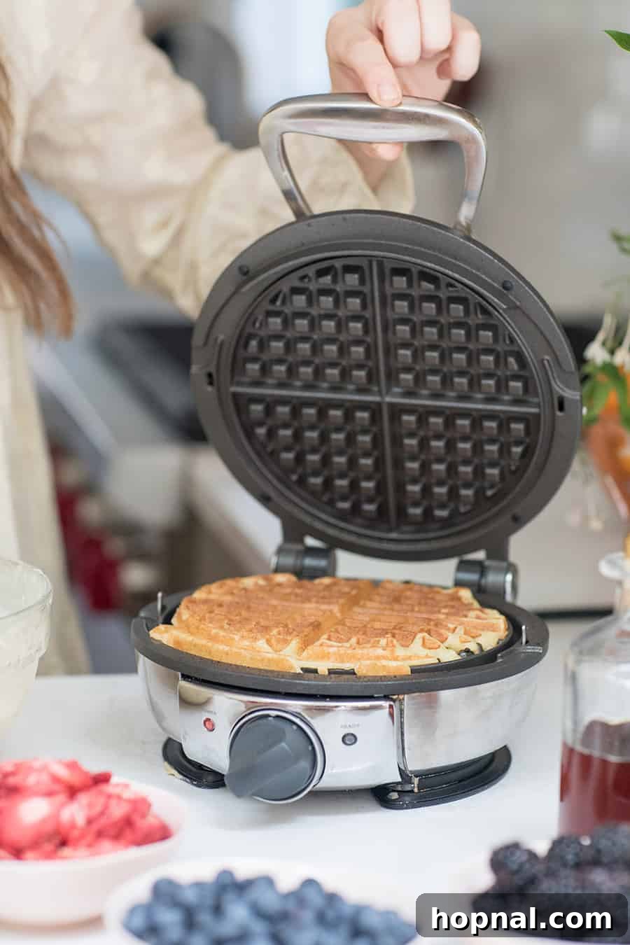 A homemade waffle inside a waffle maker.