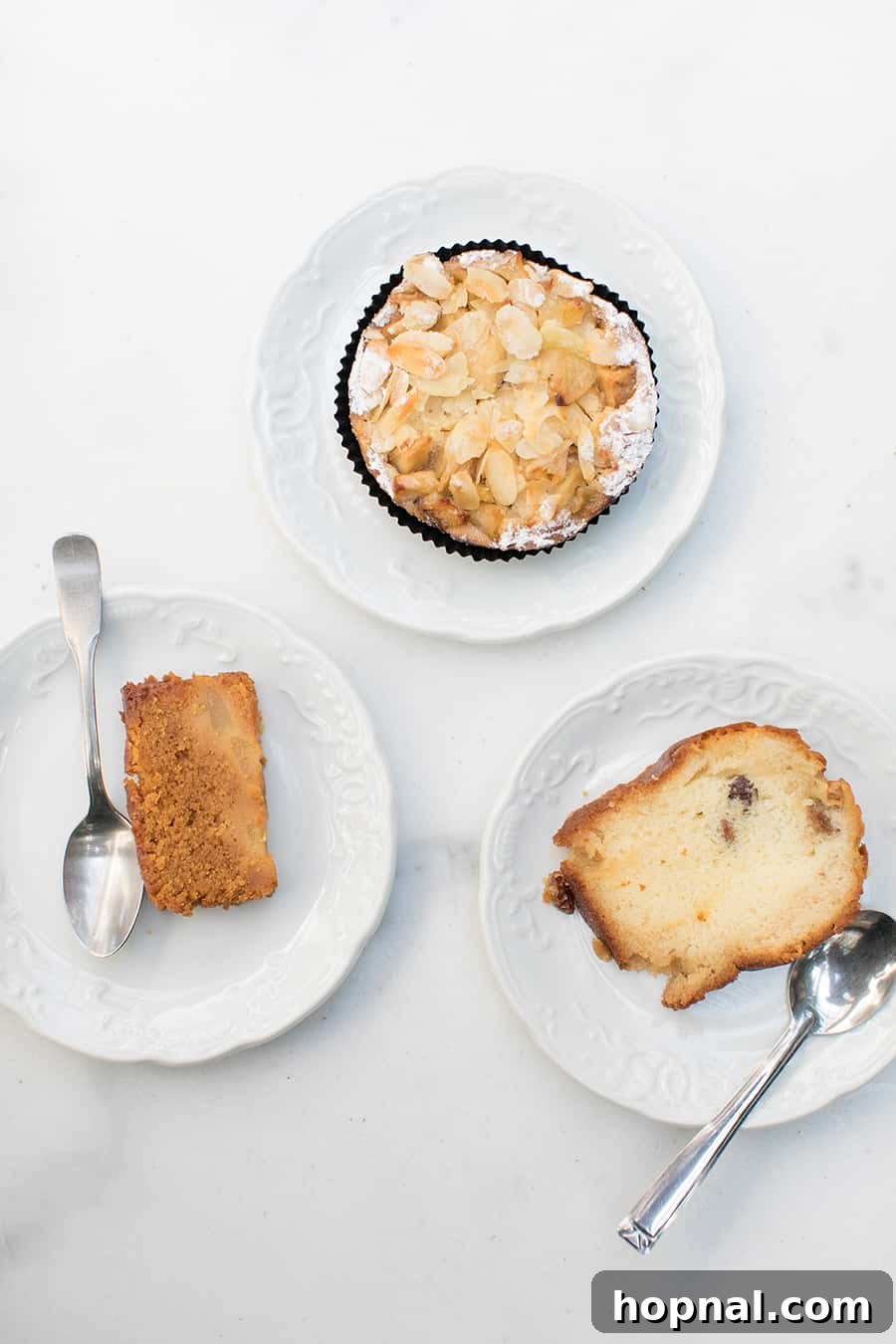 Delicious pastries and cakes displayed on white plates at Palais Bénédictine cafe