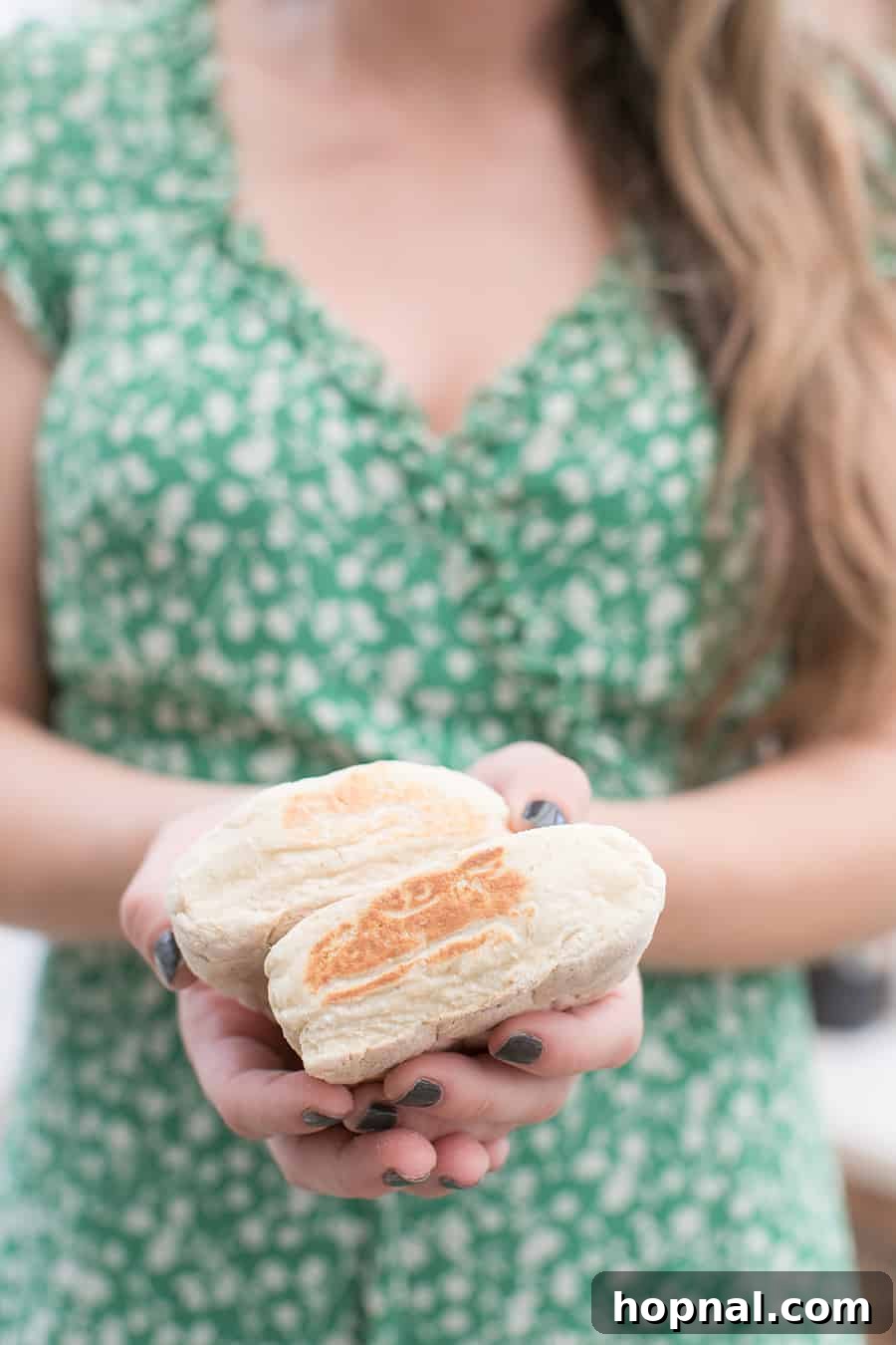 Master the Art of Irish Soda Bread 2 Girl holding a freshly baked loaf of homemade Irish soda bread, smiling warmly.