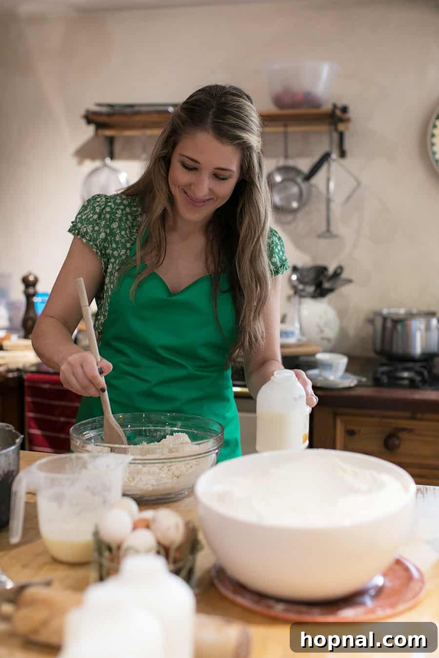 Master the Art of Irish Soda Bread 5 Eden Passante gently mixing the ingredients for Irish soda bread in a bowl inside a cozy Northern Irish cottage.