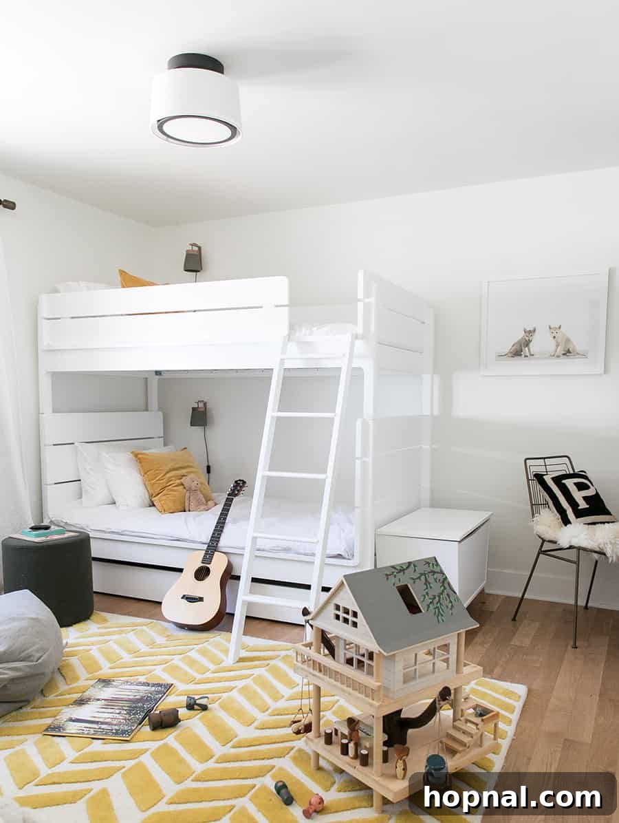 Boys room with white bunkbeds, yellow rug and a tree house toy.